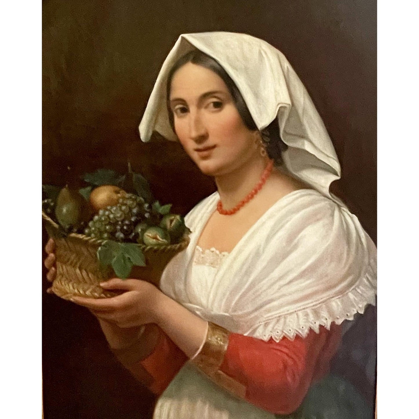 Antique Oil on Canvas of an Attractive Young Woman Holding a Basket of Fruit