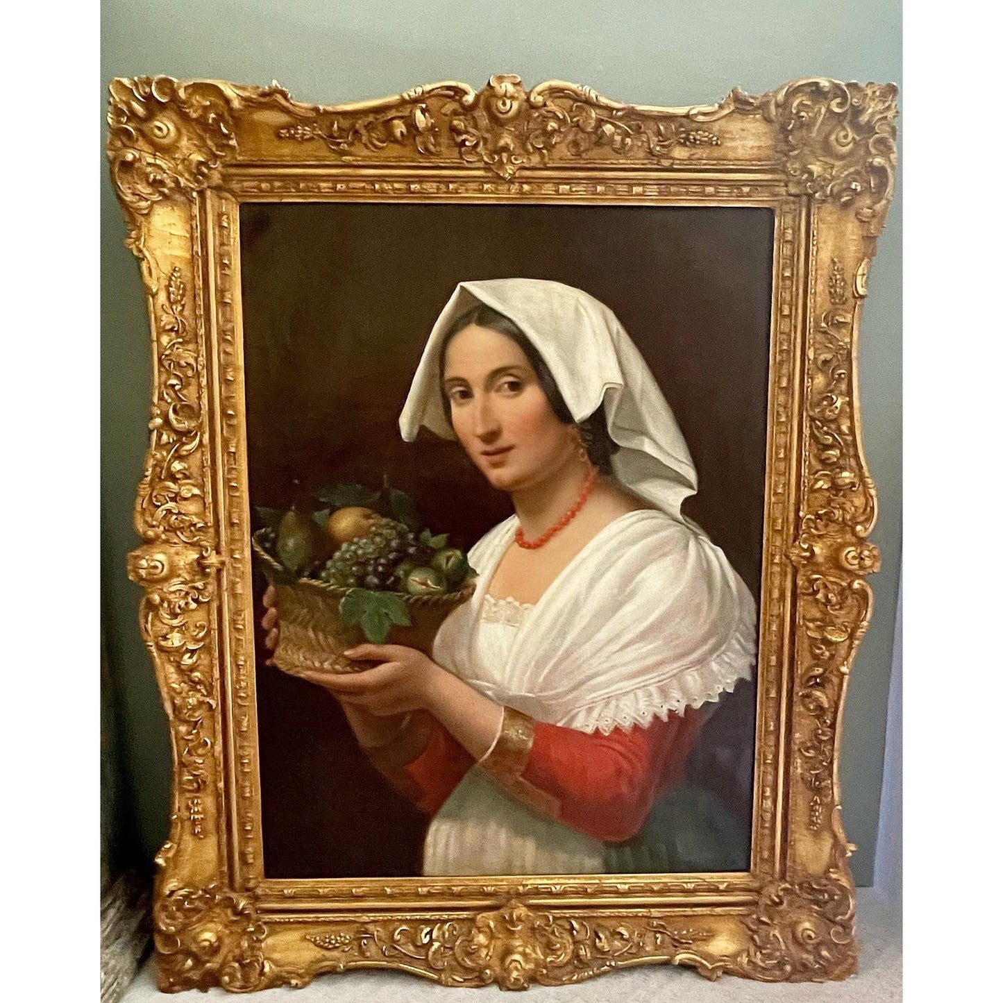 Antique Oil on Canvas of an Attractive Young Woman Holding a Basket of Fruit